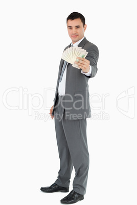 Businessman presenting banknotes
