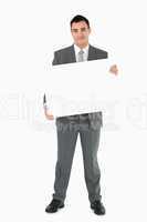 Businessman holding sign