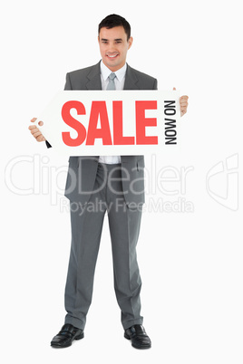 Businessman with signboard