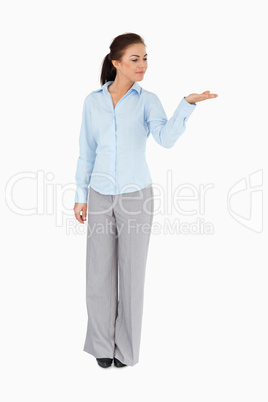 Businesswoman looking at what she is presenting Businesswoman looking at what she is presenting