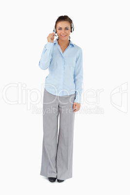 Businesswoman talking to caller through headset