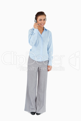 Smiling businesswoman talking with headset on