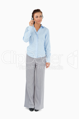 Businesswoman listening to caller with headset on