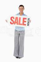 Businesswoman holding sign