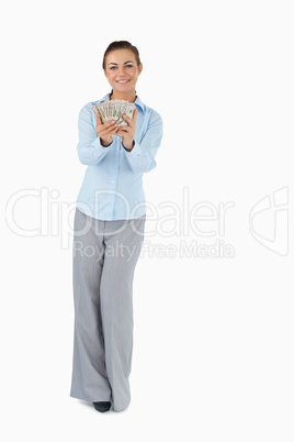 Smiling businesswoman presenting banknotes