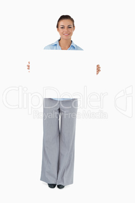 Businesswoman presenting sign