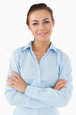 Smiling businesswoman with arms folded