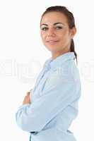 Side view of businesswoman with arms folded