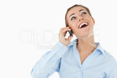 Laughing businesswoman on the phone