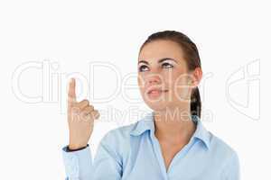 Businesswoman pointing with her finger upwards