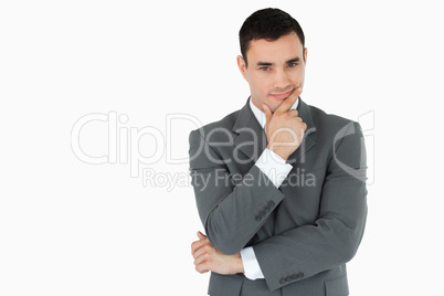 Young businessman lost in thoughts