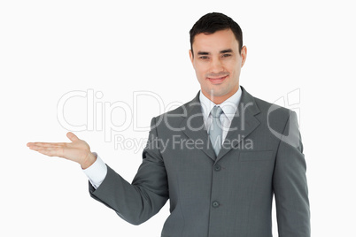 Businessman presenting something in his palm