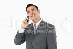 Businessman on the phone looking upwards