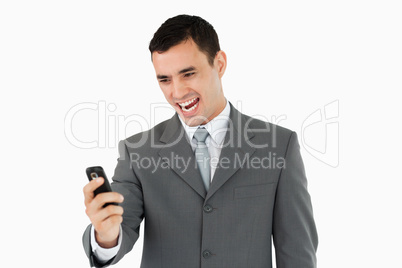 Businessman happy about text message