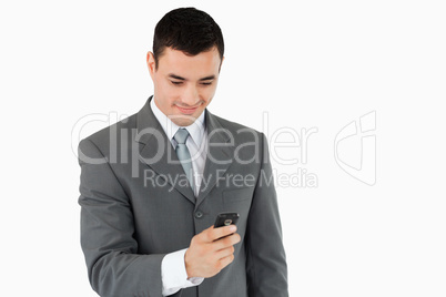 Businessman texting with his cellphone