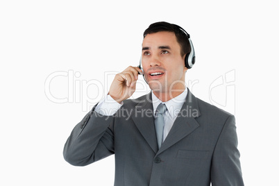 Male call center agent looking upwards