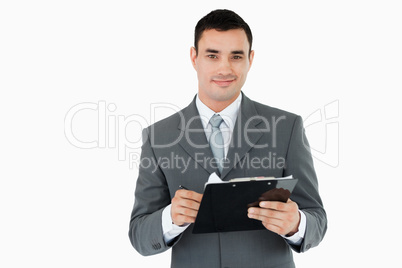 Businessman with clipboard and pen