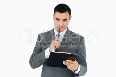 Businessman with pen and clipboard