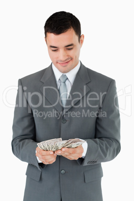 Businessman counting bank notes