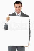 Businessman presenting sign