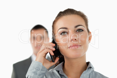 Close up of confident businesswoman on the phone with colleague
