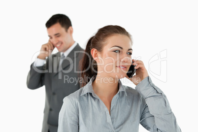 Close up of business partners talking on the phone