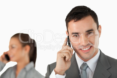 Close up of business partners on the phone