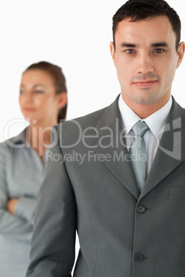 Close up of businessman with colleague behind him