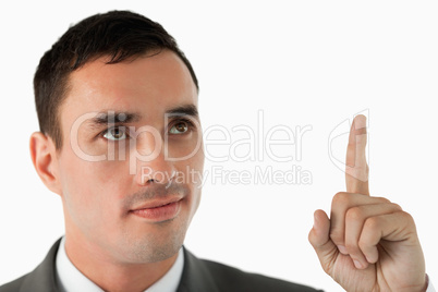 Close up of businessman pointing upwards