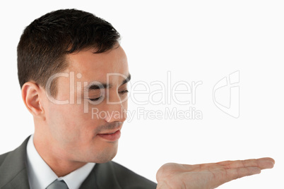 Close up of businessman looking at what he is presenting in his