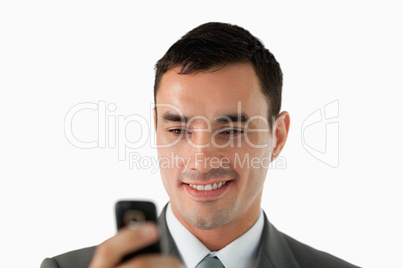 Close up of businessman reading a text message