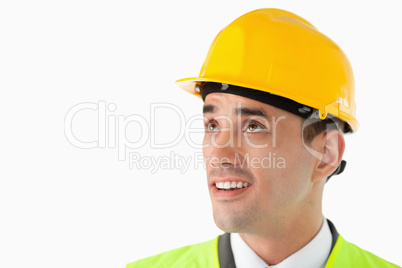 Close up of architect with helmet on looking to the side