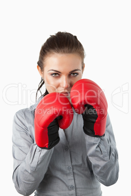 Businesswoman with boxing gloves on