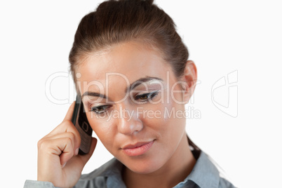 Close up of businesswoman listening closely to caller