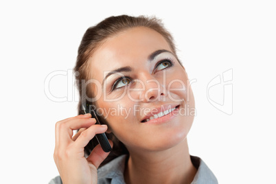 Close up of businesswoman on her phone looking diagonally upward