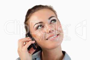 Close up of businesswoman on her phone looking diagonally upward