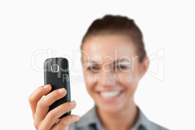 Close up of text message being read by businesswoman