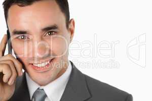 Close up of happy businessman on his phone