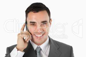 Close up of friendly businessman on the phone