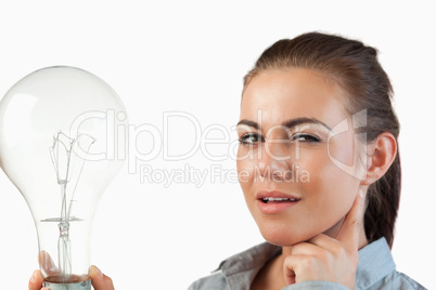 Businesswoman with huge light bulb