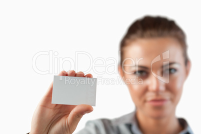 Close up of business card being shown by businesswoman