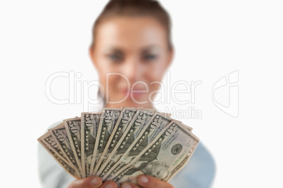 Money being shown by businesswoman