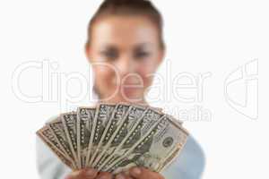 Money being shown by businesswoman