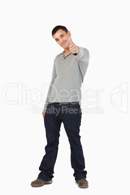 Young guy giving thumb up