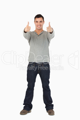 Young guy giving thumbs up