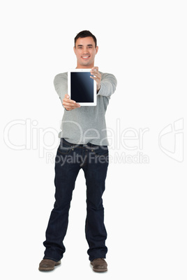 Young male presenting his tablet