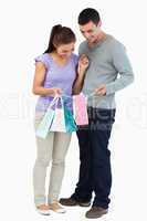 Young couple looking at their shopping