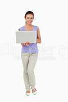 Young female holding her laptop