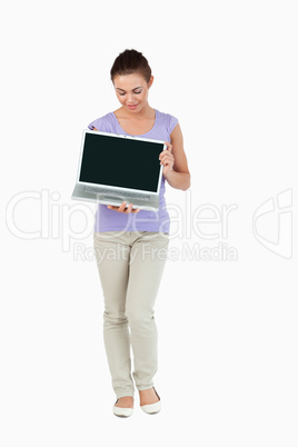 Young female presenting her laptop screen