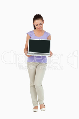 Young female holding her laptop